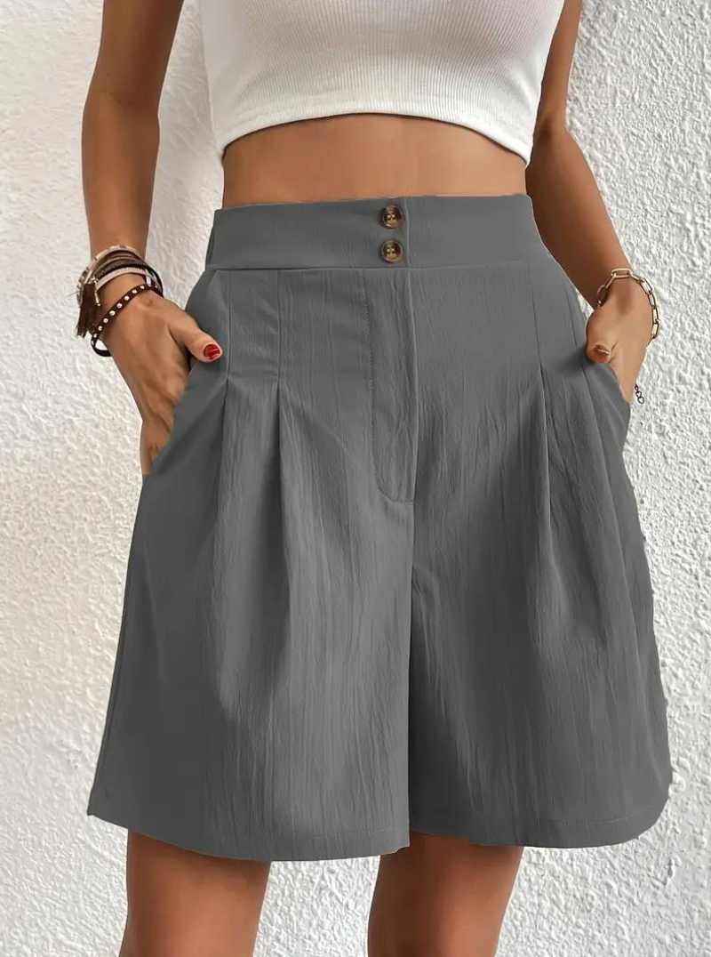 "Zomershort met plooien, hoge taille, zakken en luchtige pasvorm, ideaal voor elegante, comfortabele zomerse look."