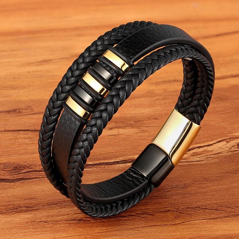 "Zwart-gouden lederen herenarmband, tijdloos ontwerp, dubbele banden, mannen accessoire, elegant en stijlvol."