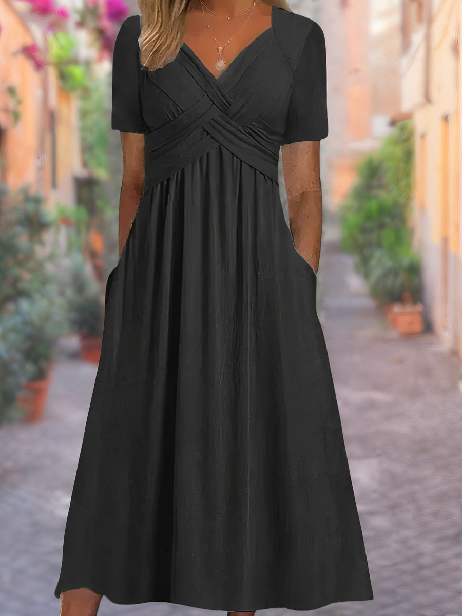 "Zwarte zomerjurk met V-hals, lichtgewicht stof, elegante details en comfortabel voor warme dagen, damesmode"