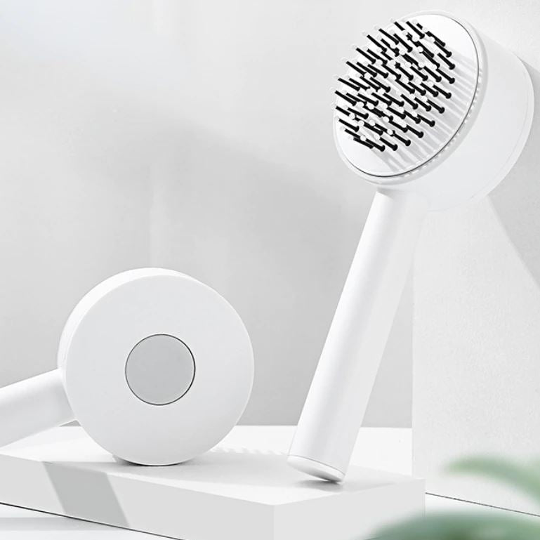 Zelfreinigende haarborstel met innovatief push-mechanisme voor moeiteloze hygiëne en glanzend haar.