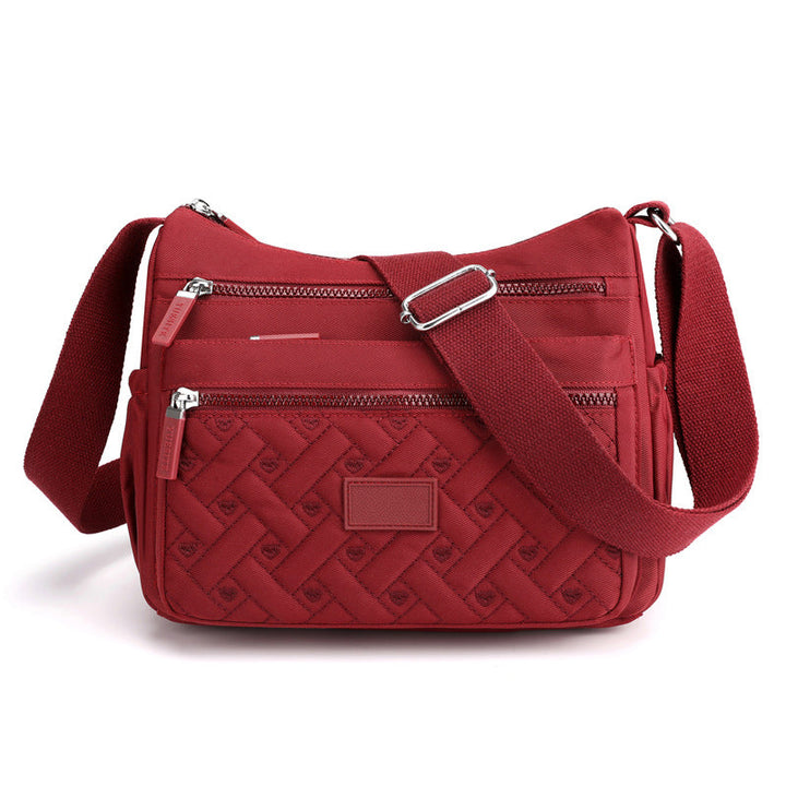 Georganiseerde SANDSBERGORIGINALS dames tas, klassieke elegantie en functionaliteit.