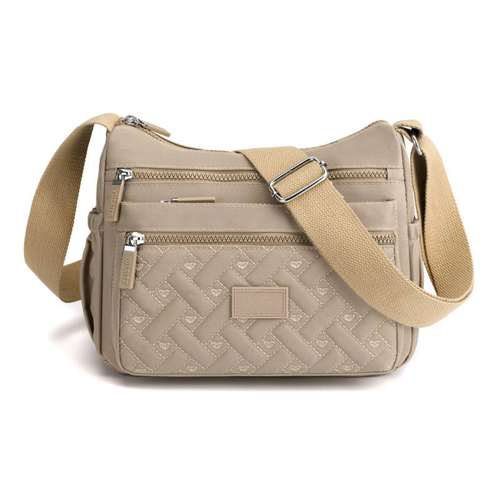 SANDSBERGORIGINALS luxe dames schoudertas, klassiek design met focus op organisatie.