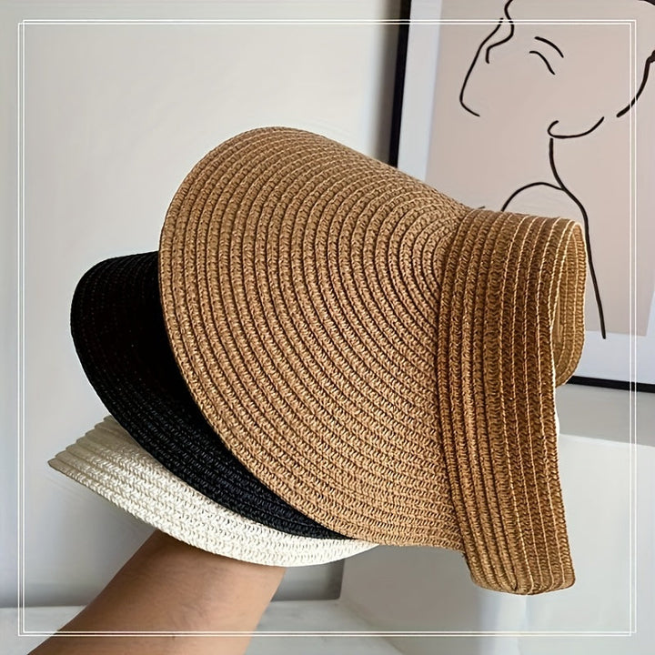 Elegante dames zonneklep met brede rand, stijlvol en opvouwbaar. Essentieel hoofddeksel voor de zomer.