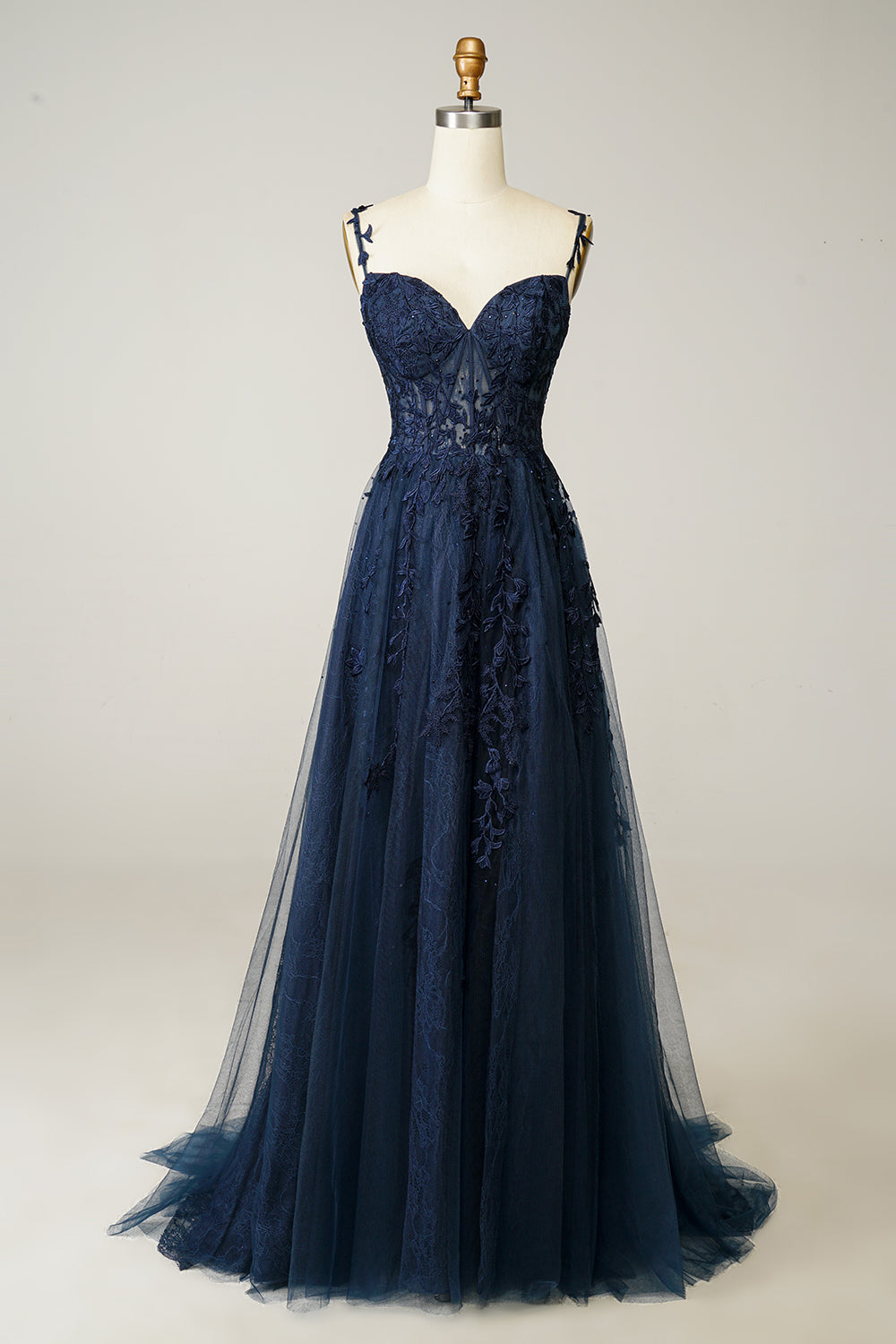 Elegante donkerblauwe A-lijn baljurk voor dames met fijne spaghettibandjes, perfect voor gala of feest.