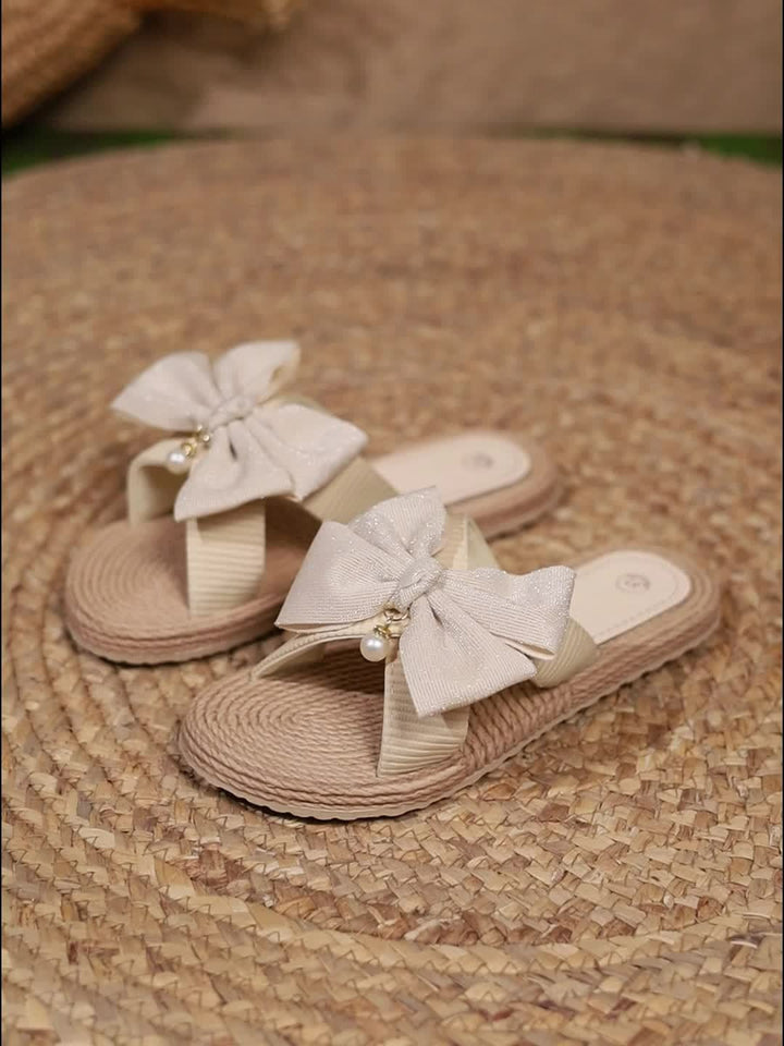 Comfortabele open teen dames slippers met stijlvolle strikjes, perfect voor casual zomerdagen.