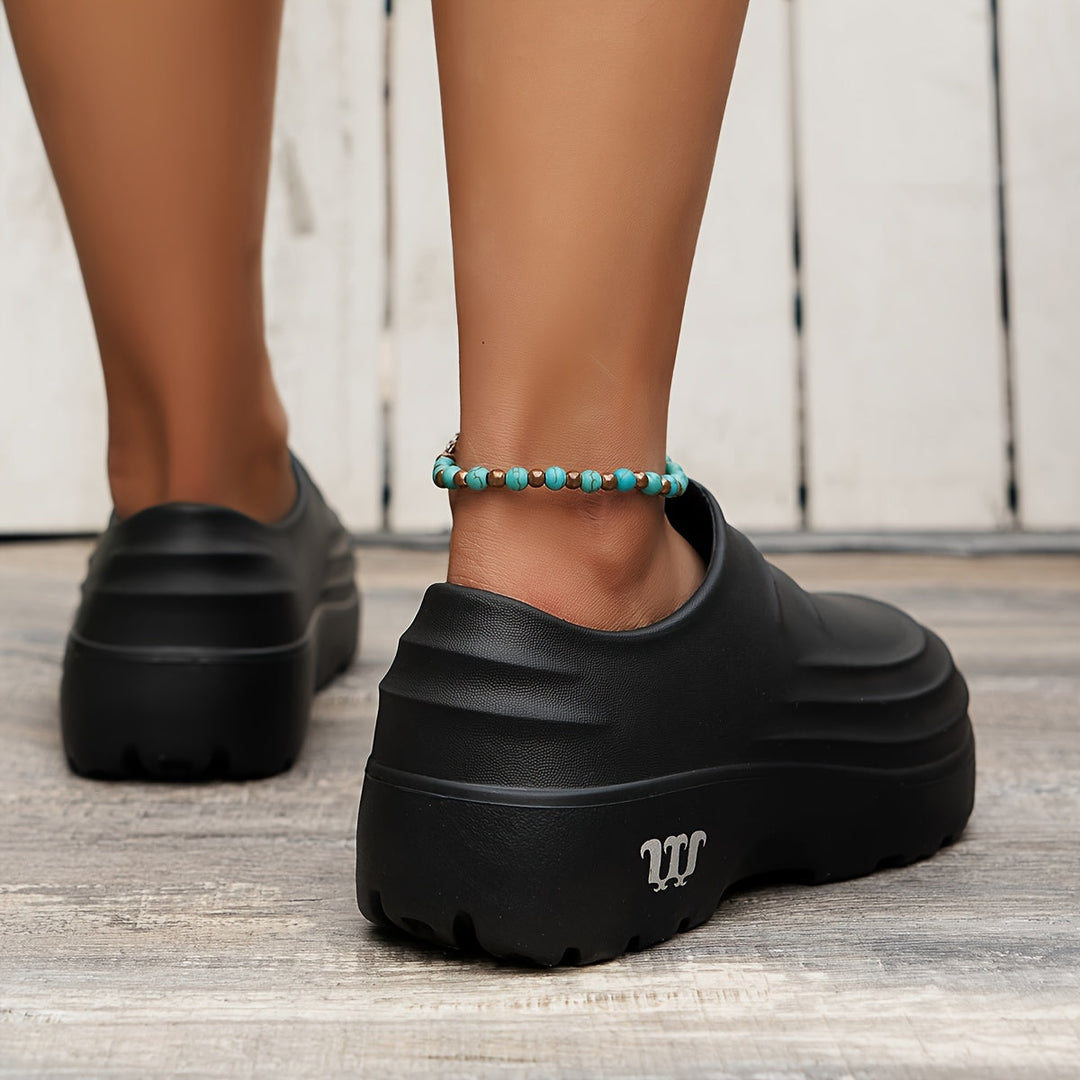 Unisex AquaStep clogs, waterdicht en orthopedisch, geschikt voor diverse beroepen en dagelijks gebruik.