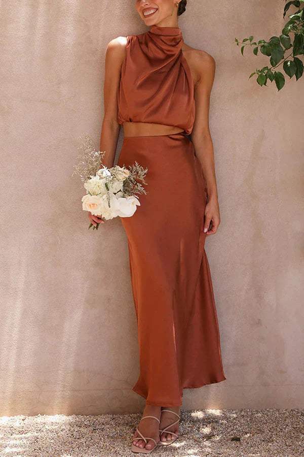 Veelzijdige dames tweedelige set met comfortabele top en lange rok, geschikt voor zowel casual als feestelijk.