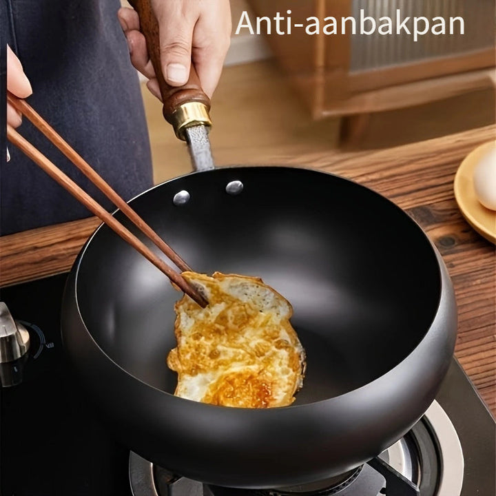 Inductie-geschikte ChefMaster gietijzeren pan, veelzijdig kookgerei voor modern koken.