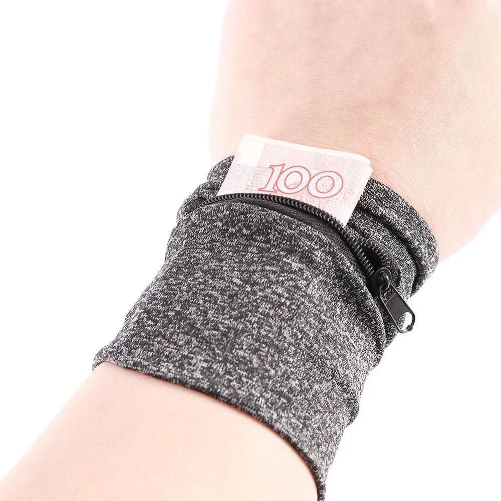 Grijze unisex polsband portemonnee voor hardlopen, sport en reizen. Veilig opbergen van essentiële spullen.