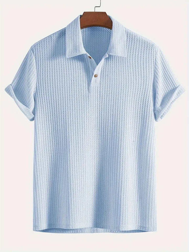 Zwarte heren jacquard polo, comfortabel en stijlvol. Perfect voor een casual outfit of herenmode bovendeel.