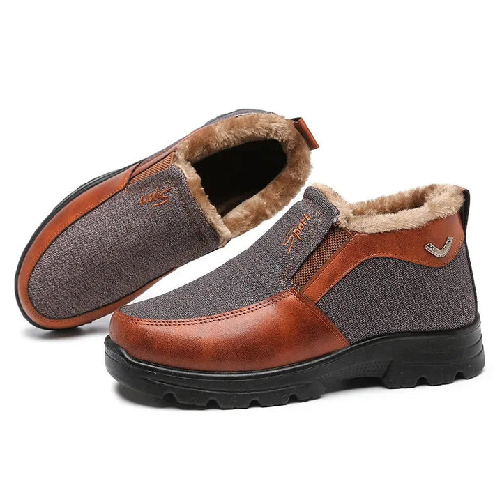 Zwarte warme heren instap winterschoenen met zachte voering, voor ultiem comfort en winterstijl.