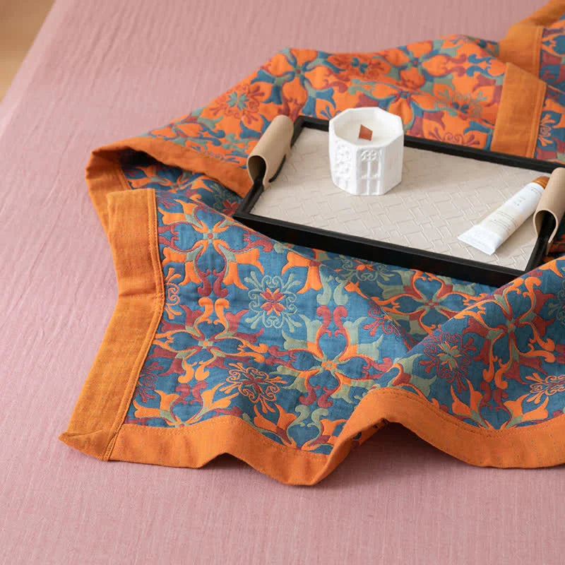 Sfeervol oranje & blauw katoenen quilt. Zeslaags dekbed van TerraLoom, ideaal als warm beddengoed.