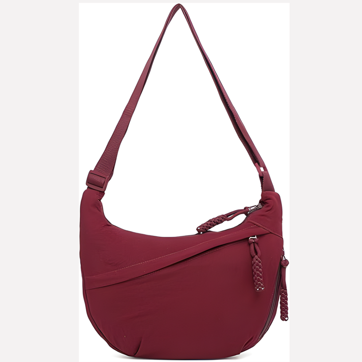 Veelzijdige nylon halvemaan tas voor vrouwen. Comfortabele schoudertas met verstelbare band, ruim en trendy.