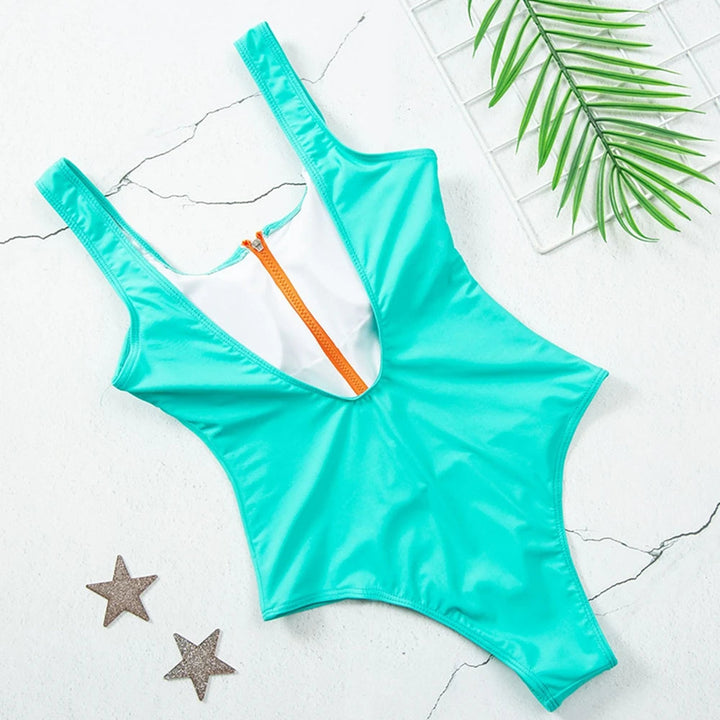 Zelfverzekerd dames badpak met rits en effen kleur, jouw keuze voor zomerse elegantie.