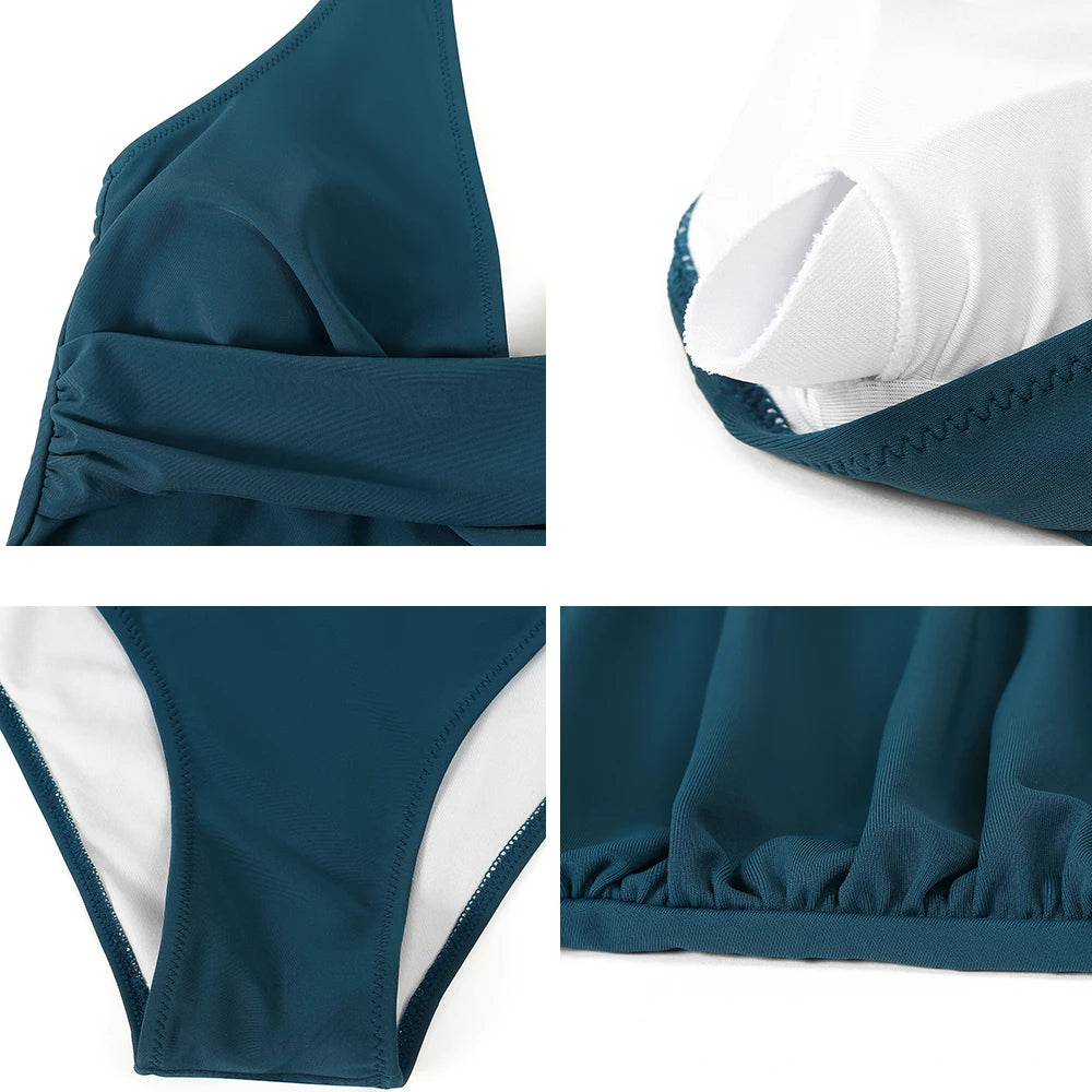 Dames eenstuk zwempak met push-up, open rug en elegant ruche detail.