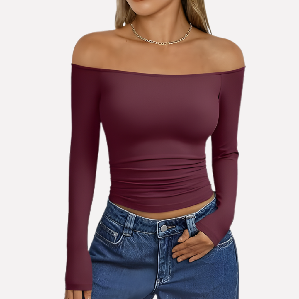 Lichte en luchtige off-shoulder damestop met lange mouwen, ideaal voor lente- en zomerse dagen.