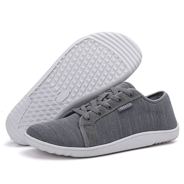 Ademende heren- en damesschoenen met brede pasvorm, zero drop en antislip EVA zool voor comfortabel wandelen.