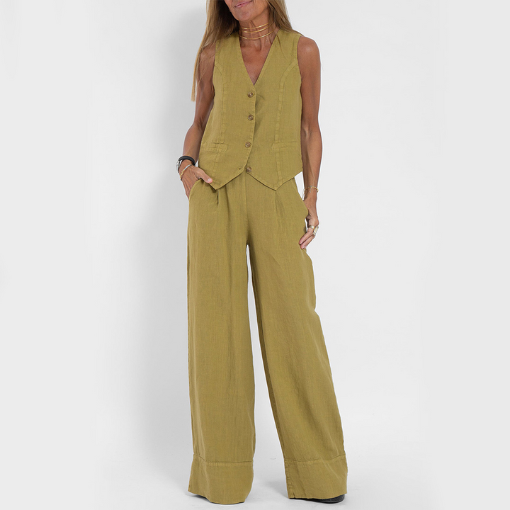Linnen damespak met mouwloos vest en lange broek, een chique set voor de zomer.