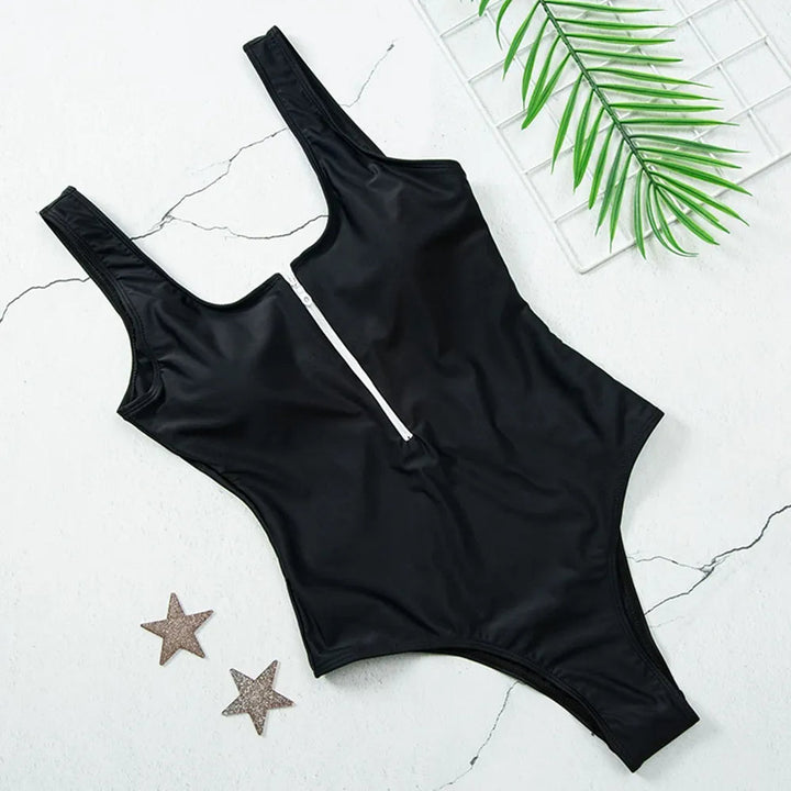 Dames zwemkleding: dit stijlvolle badpak met rits en push-up voor een fantastisch figuur.