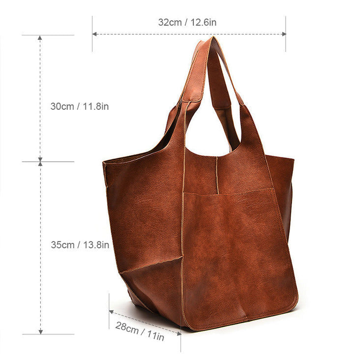 Ruime dames handtas, oversized vintage design, een essentieel modieus accessoire.