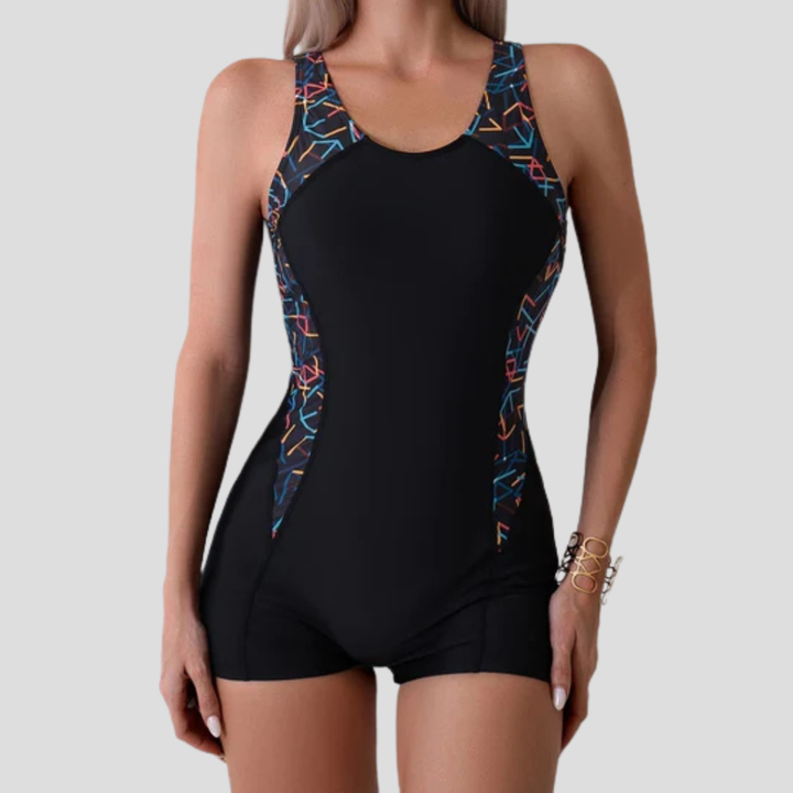 Blauw sportief dames badpak met geïntegreerde zwemshorts. Perfect voor comfortabel zwemmen en actieve zomerdagen.