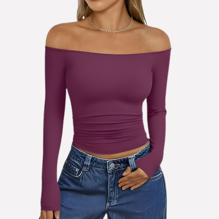 Elegante off-shoulder damestop met lange mouwen, combineert moeiteloos met jeans of rok voor complete outfit.