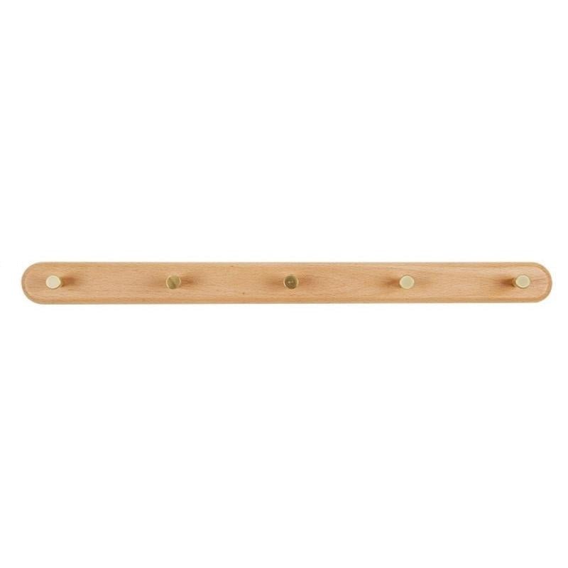 Neutrale houten wandkapstok met messing details, geschikt voor elk modern of minimalistisch huis.