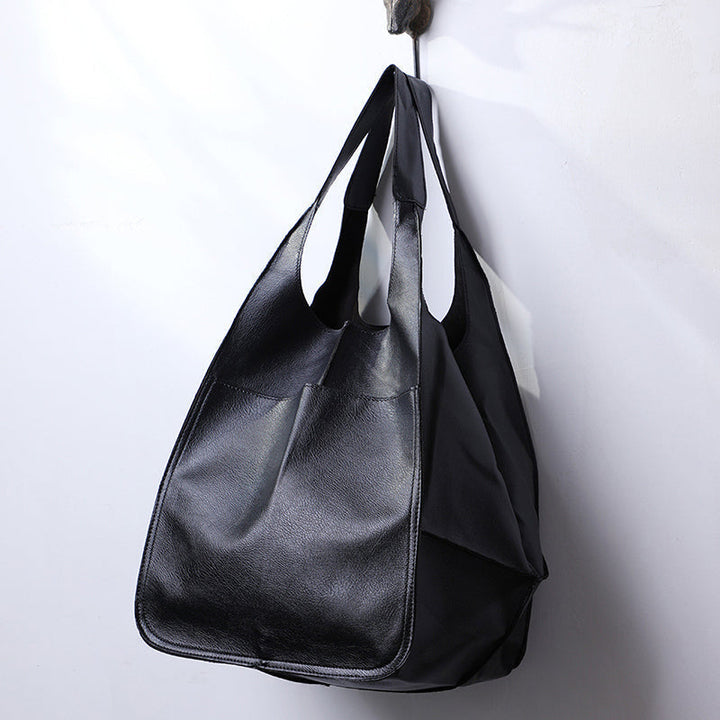 Oversized dames tas in vintage stijl, ideaal als dagelijkse tas en elegant accessoire.