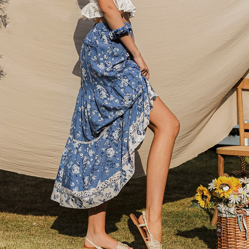 Comfortabele vloeiende damesrok met bloemenprint, hoge taille en midi lengte voor casual elegantie.