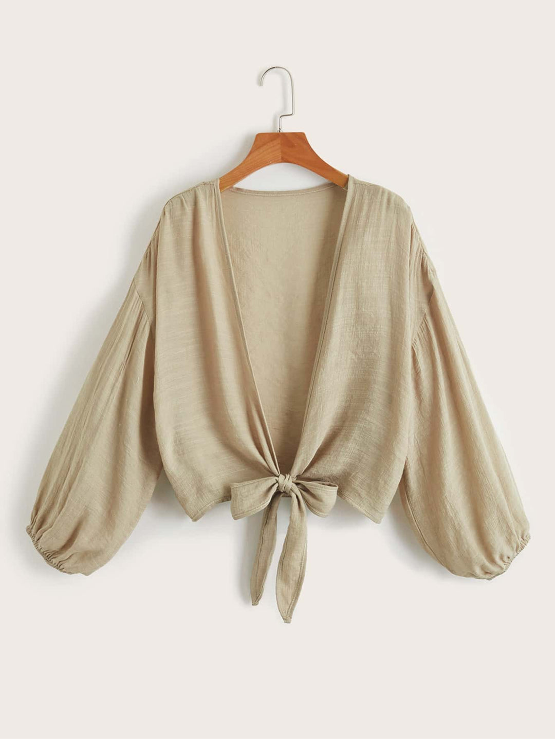 Stijlvolle cover-up: effen dames kimono met strik, ideaal voor een relaxte stranddag.
