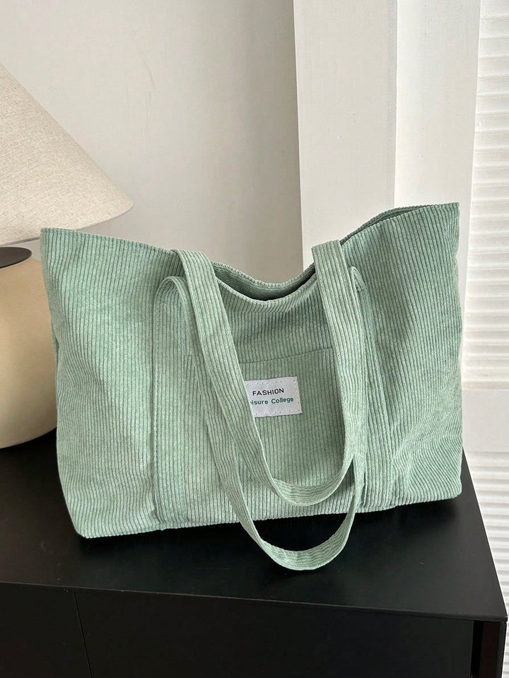 Veelzijdige corduroy werktas, ruime totebag die functionaliteit en stijl combineert.