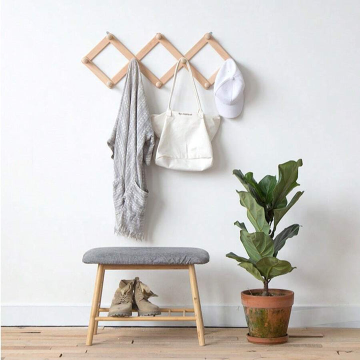 Uitschuifbare bamboe wandhaak met 10 haken, ideaal voor garderobe en halorganisatie. Natuurlijk en functioneel.
