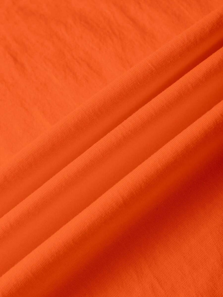 Oranje dames T-shirt met unieke fruitprint en opvallende tekst. Trendy casual dameskleding voor Koningsdag en de zomer.