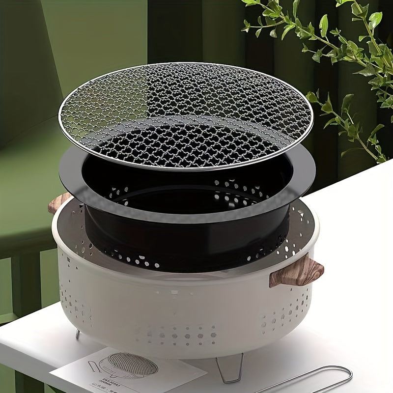 Makkelijk opvouwbare RVS houtskoolgrill, klaar voor elk buitenavontuur, compact en draagbaar design.