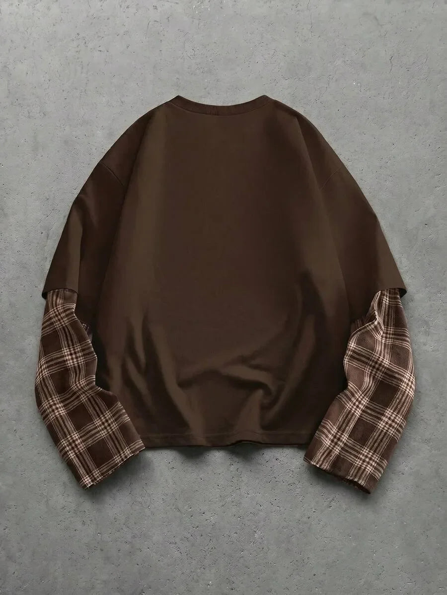 Heren t-shirt met uniek patchwork design op de mouwen. Ronde hals, lange mouw, casual.