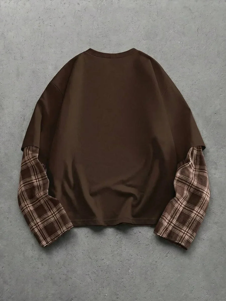 Heren t-shirt met uniek patchwork design op de mouwen. Ronde hals, lange mouw, casual.