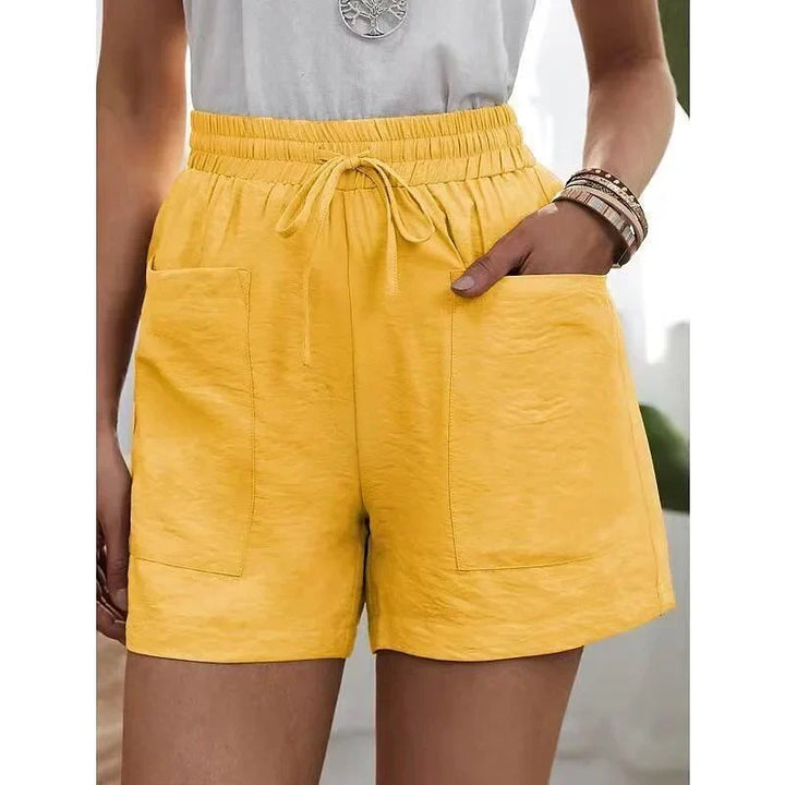 Casual dames shorts met elastische hoge tailleband, perfect voor warme zomerse dagen. Comfortabele pasvorm.