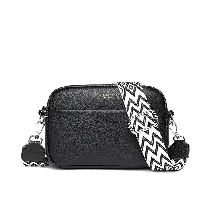 Stijlvolle leren dames schoudertas, compact en elegant, perfect accessoire voor elke outfit.
