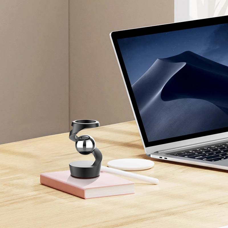 Essentieel bureau accessoire: de draaiende gyroscoop voor ontspanning en helderheid.