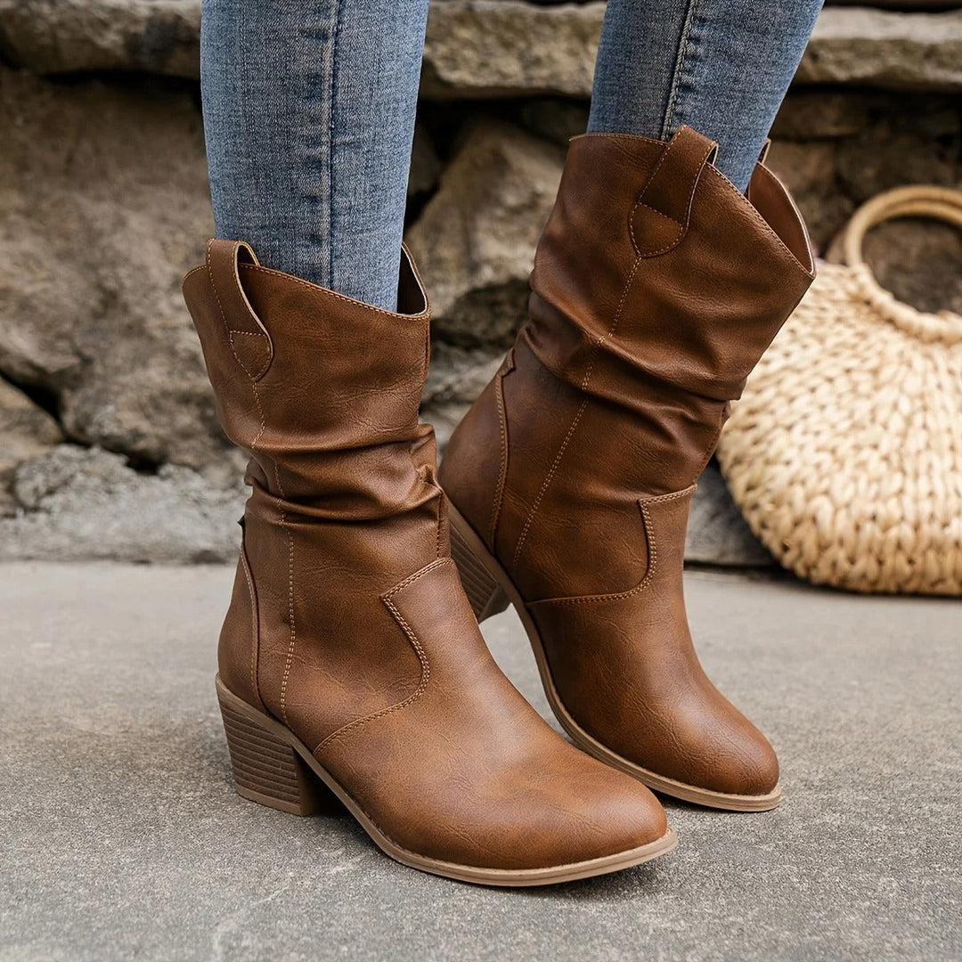Zwarte Amara dames leren laarzen met comfortabele hak, ideaal voor herfst en winter.