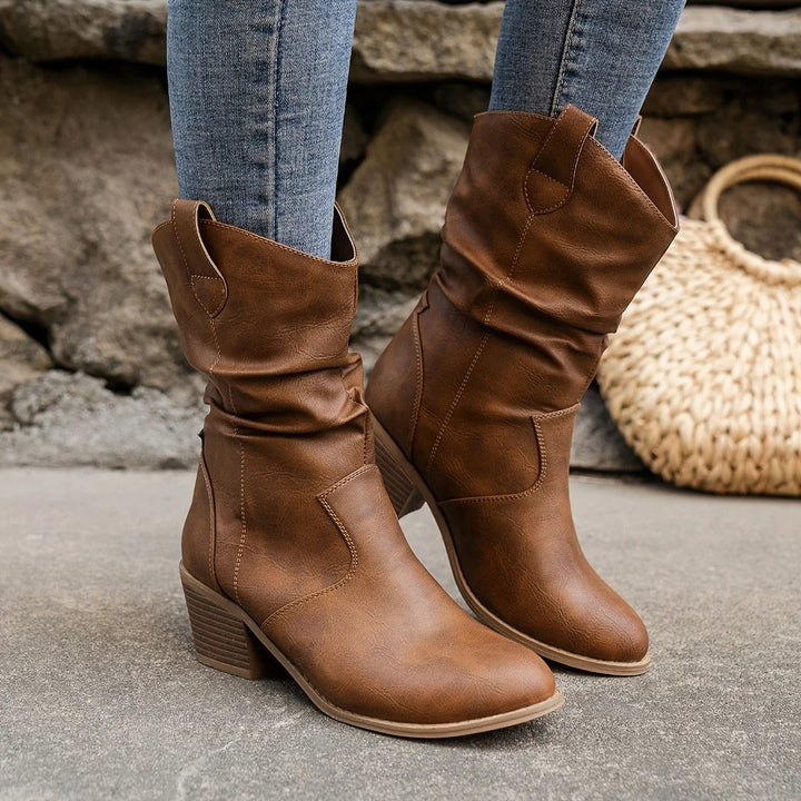 Zwarte Amara dames leren laarzen met comfortabele hak, ideaal voor herfst en winter.