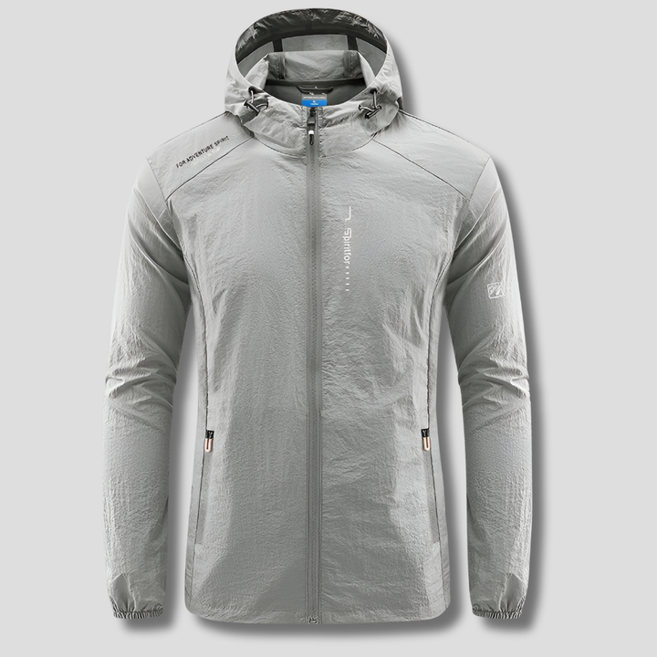 Compacte polyester heren reisjas, ultralicht met capuchon. Wind- en zonbestendig, perfect voor lente en herfst.