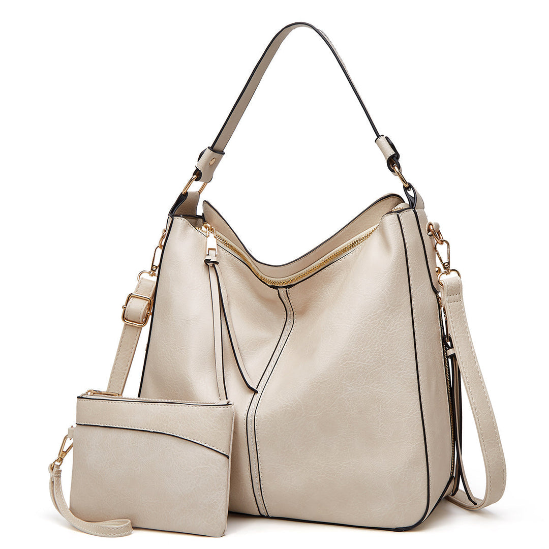 Hoogwaardige leren dames tas in tijdloos design, met opvallende gouden details, veelzijdig.