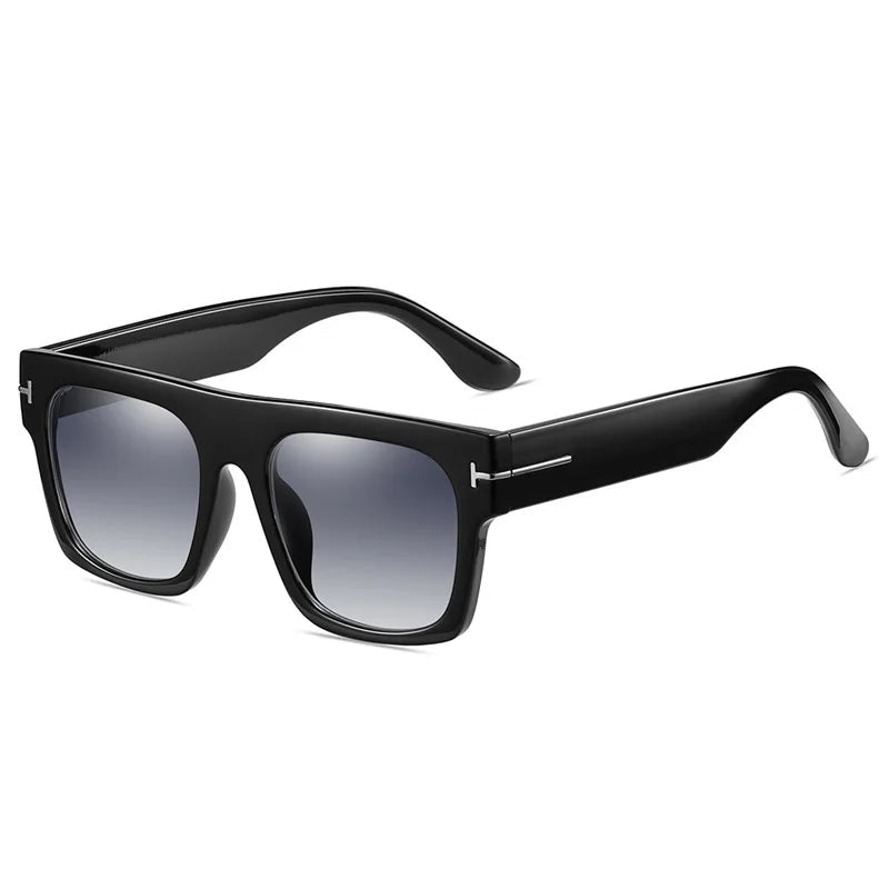 Heren vintage zonnebril met oversized matzwart montuur en blauwe glazen. Trendy mode accessoire voor oogbescherming.