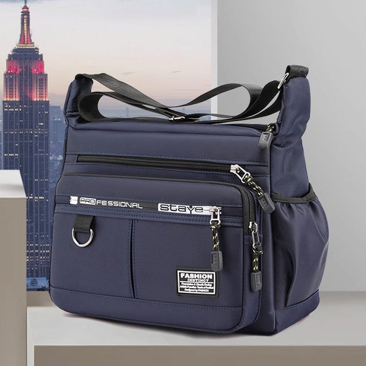 Zwarte dievenbestendige slingtas, veilige crossbody schoudertas met organizer voor heren en dames.