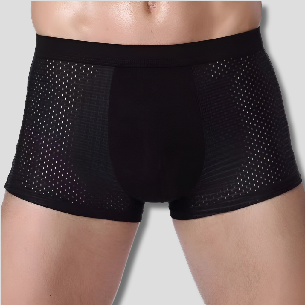 Close-up van de zachte stof en elastische tailleband van een blauwe heren boxershort, voor optimale pasvorm en comfort.