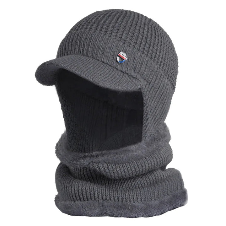 Stijlvolle gebreide herenmuts met klep. Ideaal voor winterse mode en outdoor activiteiten.