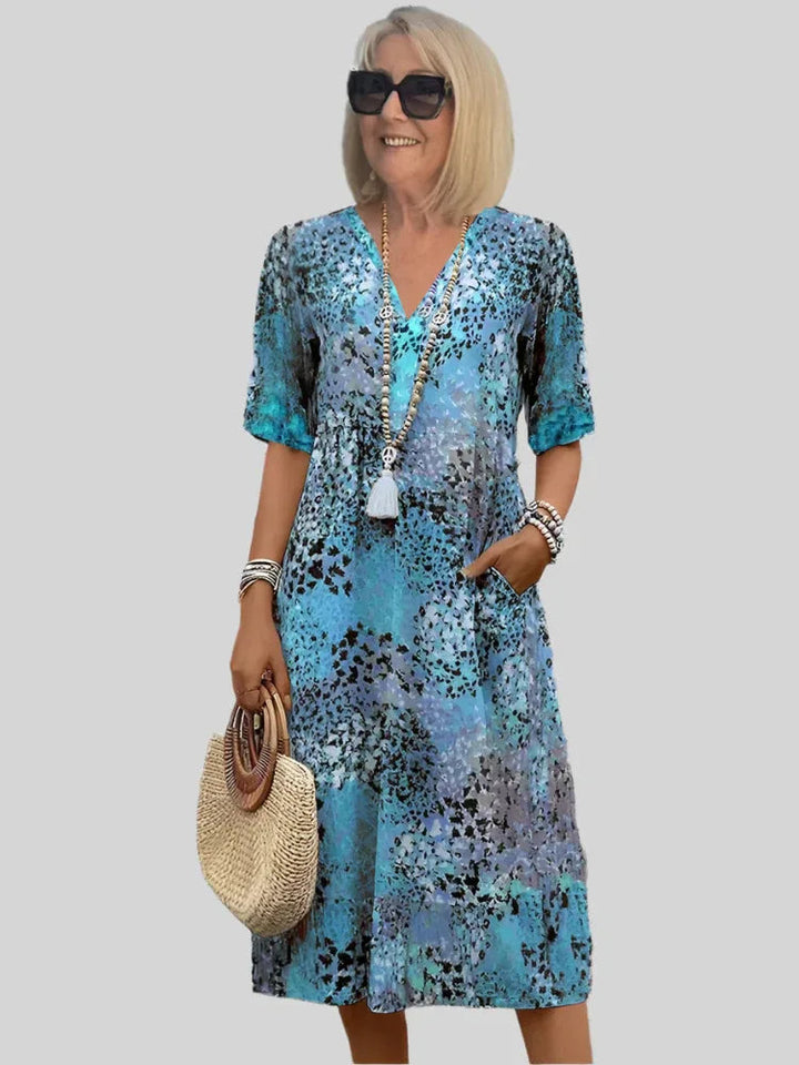 Vintage print damesjurk met elegant kant en diepe v-hals. Perfecte boho zomerjurk van polyester.