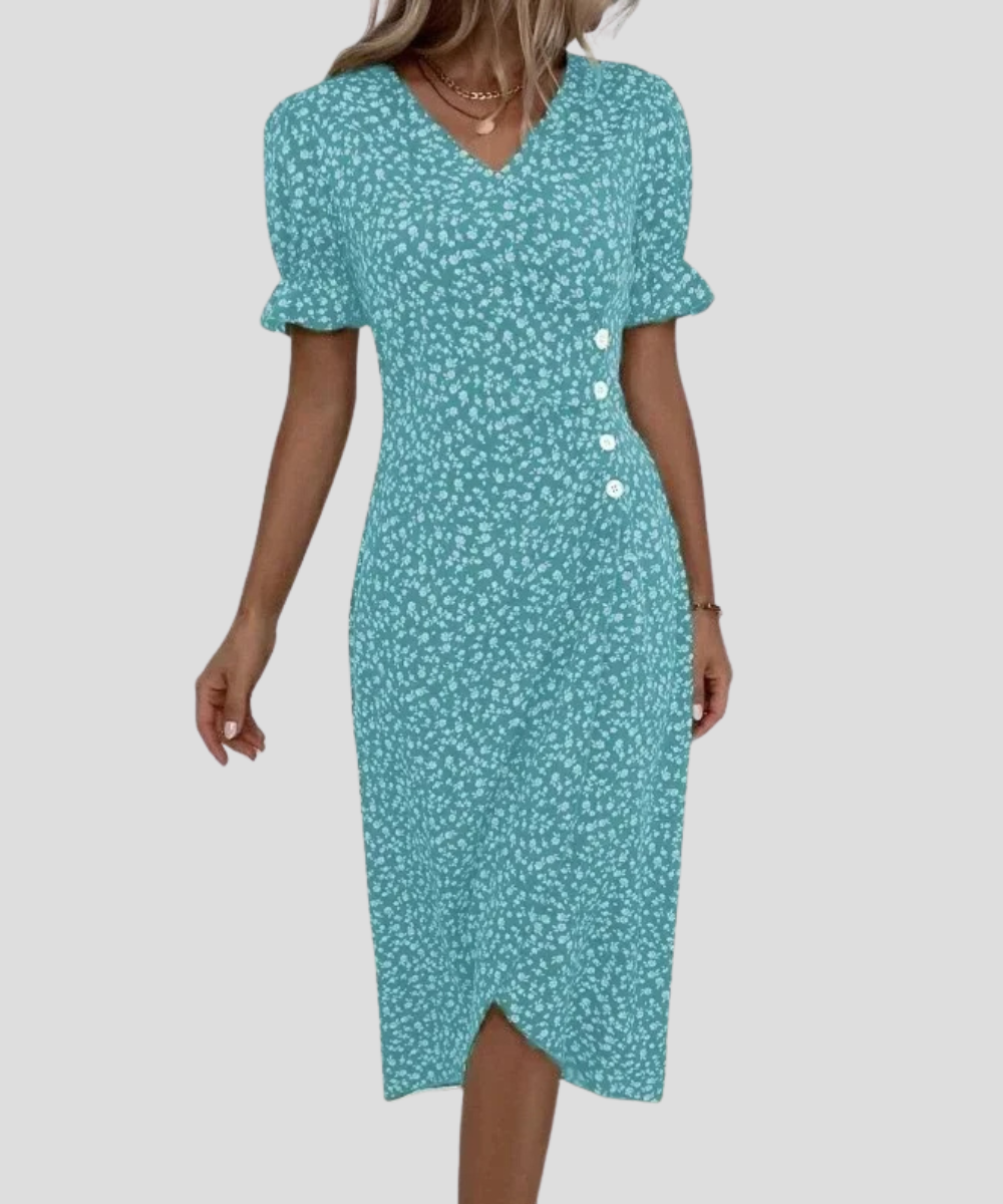 Model draagt elegante dames midi jurk met bloemen, V-hals, pofmouwen, perfect voor een zomerse dag.