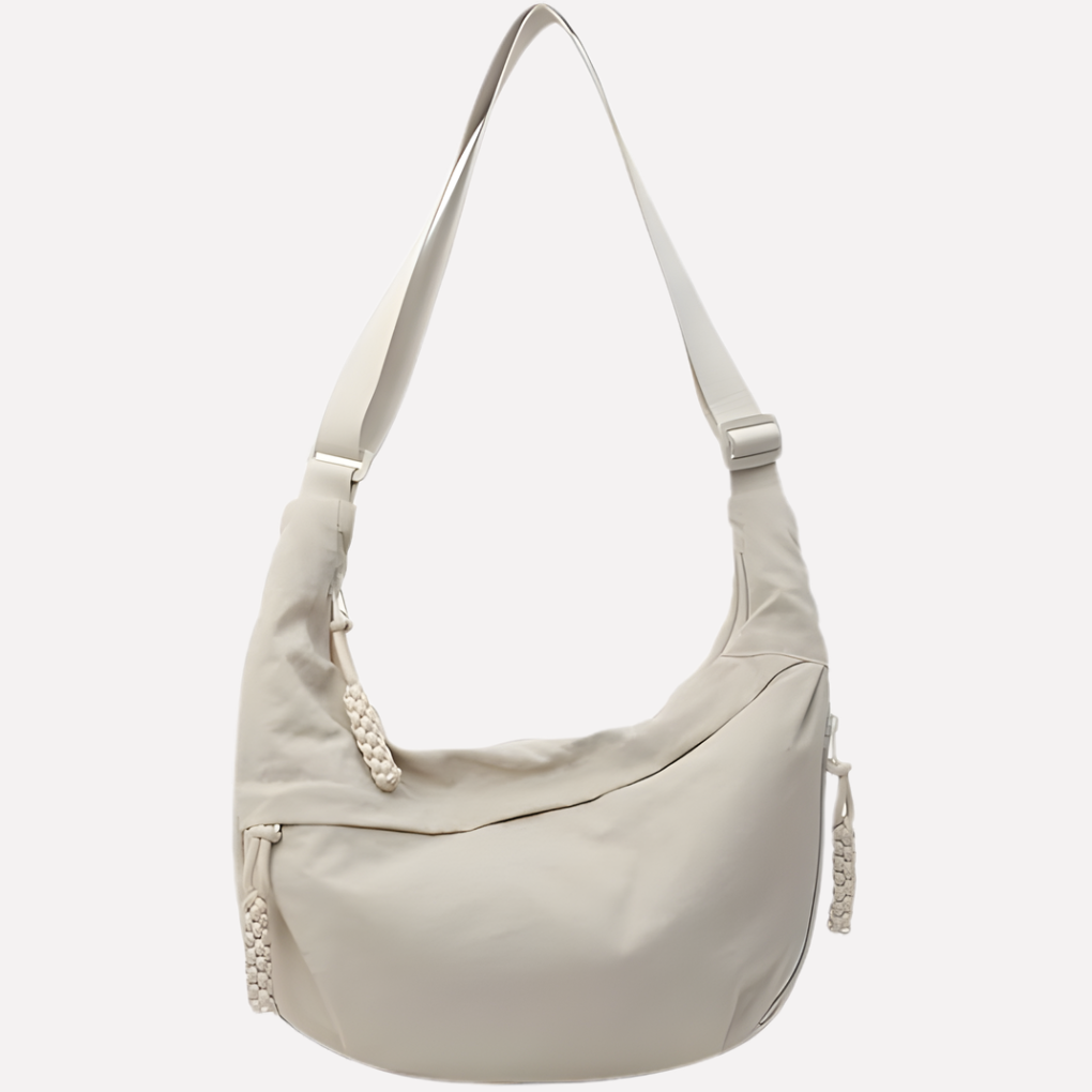 Vrouwen halvemaan crossbodytas van nylon. Praktische en stijlvolle schoudertas met verstelbare band.